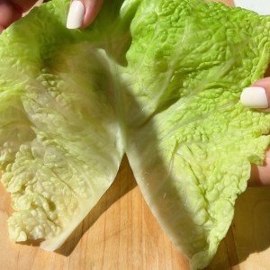 remove the thick stem from the cabbage leaves